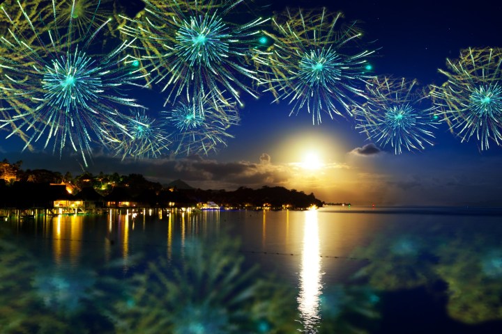 a group of fireworks in the water
