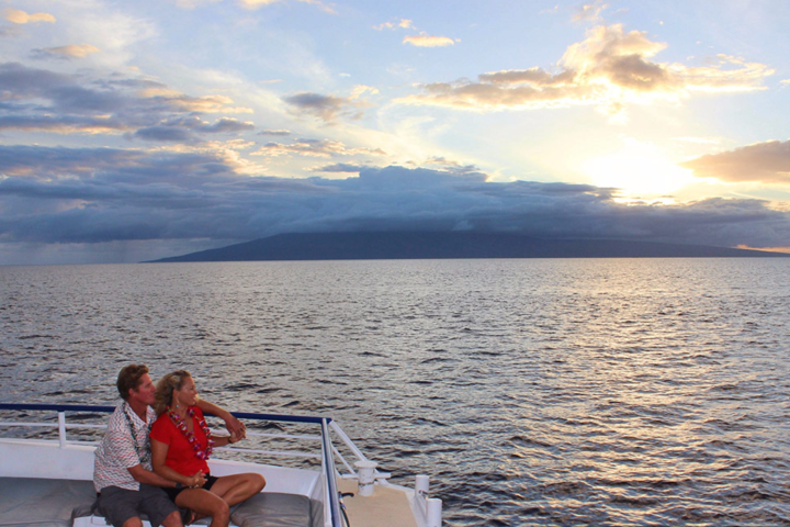 a person sitting on a boat in a body of water