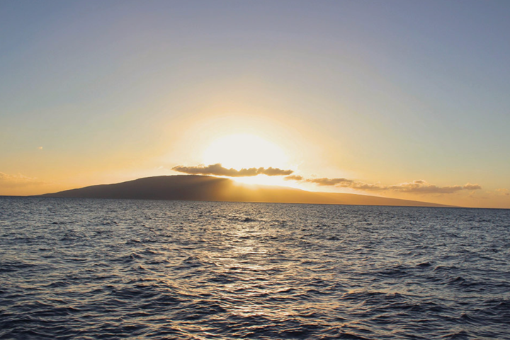 a sunset over a body of water