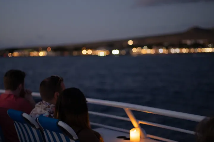 A couple enjoying a sunset dinner cruise from lahaina