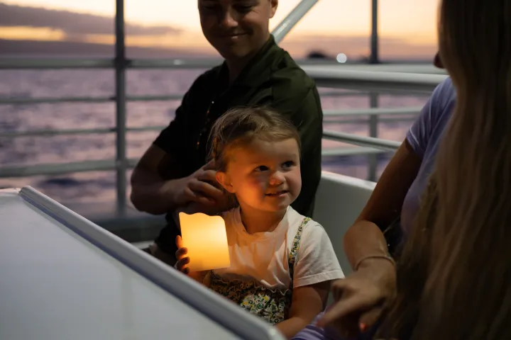 Children enjoying the Sunset Dinner Cruise From Lahaina