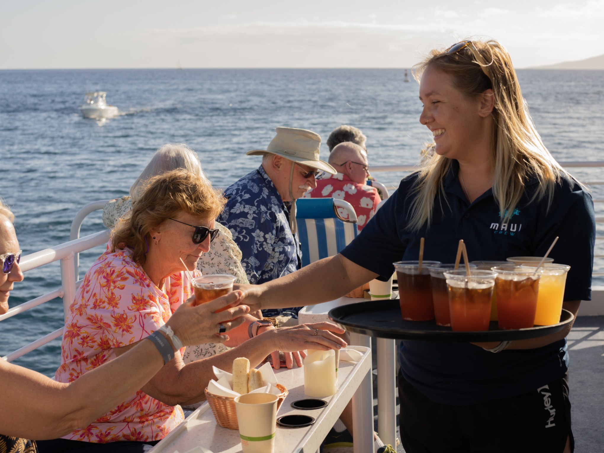 a couple of people are drinking from the water