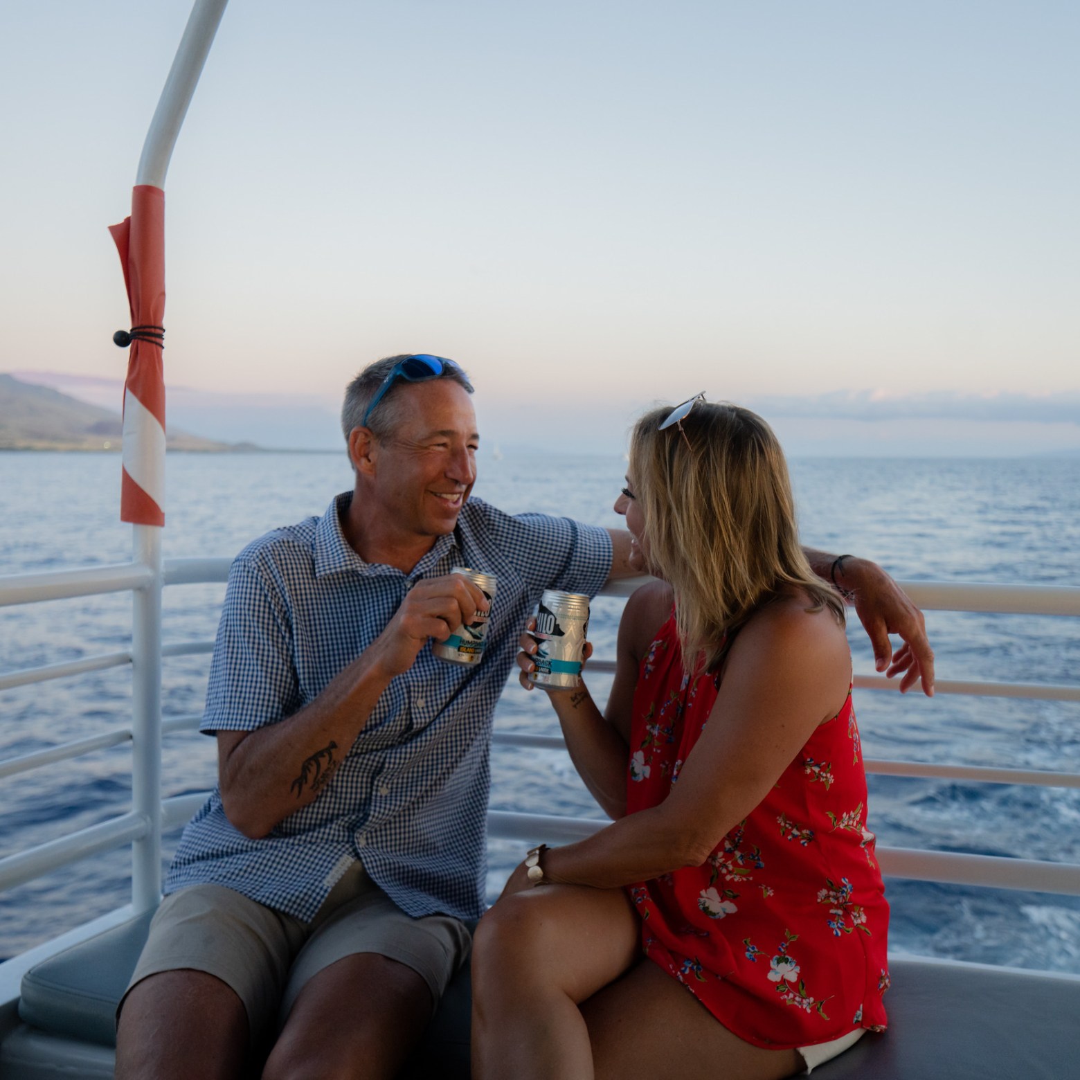 a person sitting next to a body of water
