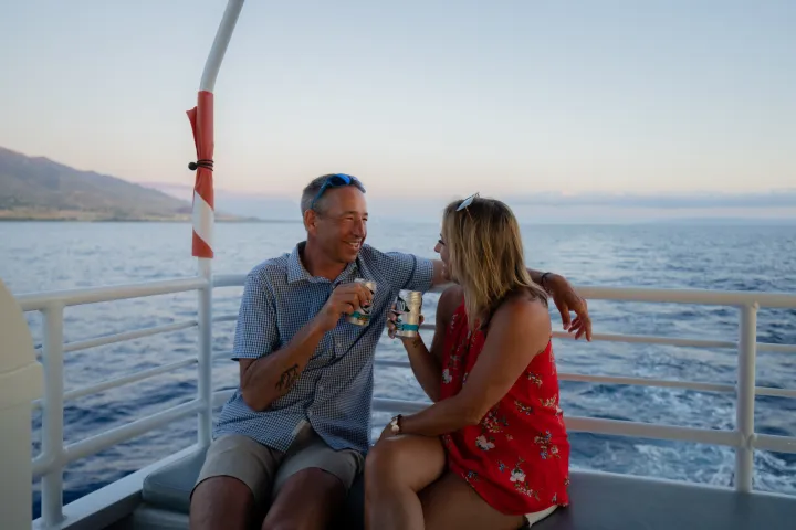 a person sitting next to a body of water