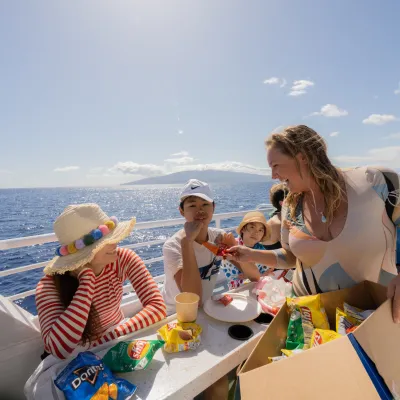 a person drinking water from a beach