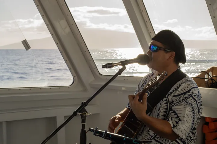 a woman standing in front of a boat