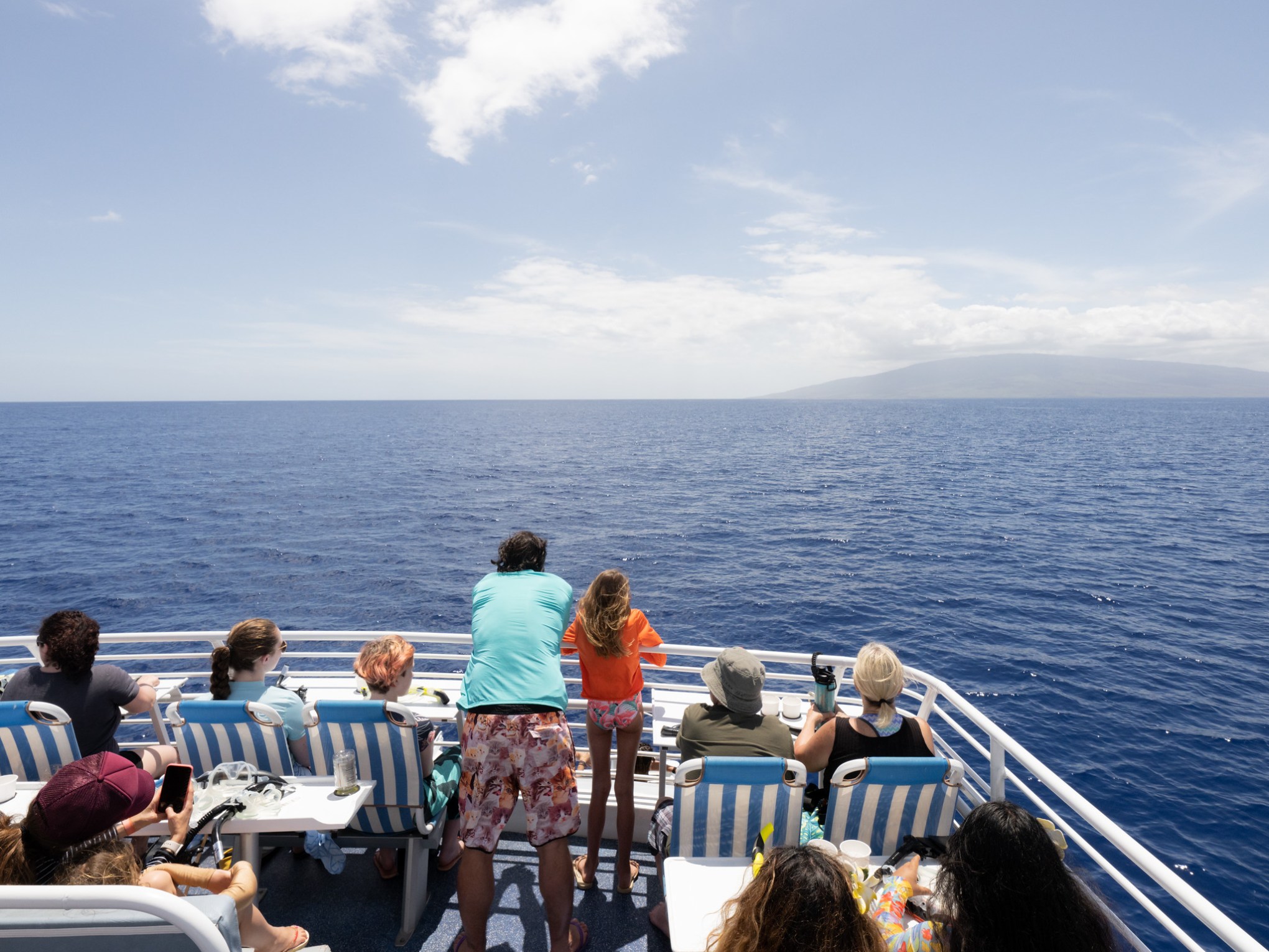 a group of people in a boat on a body of water