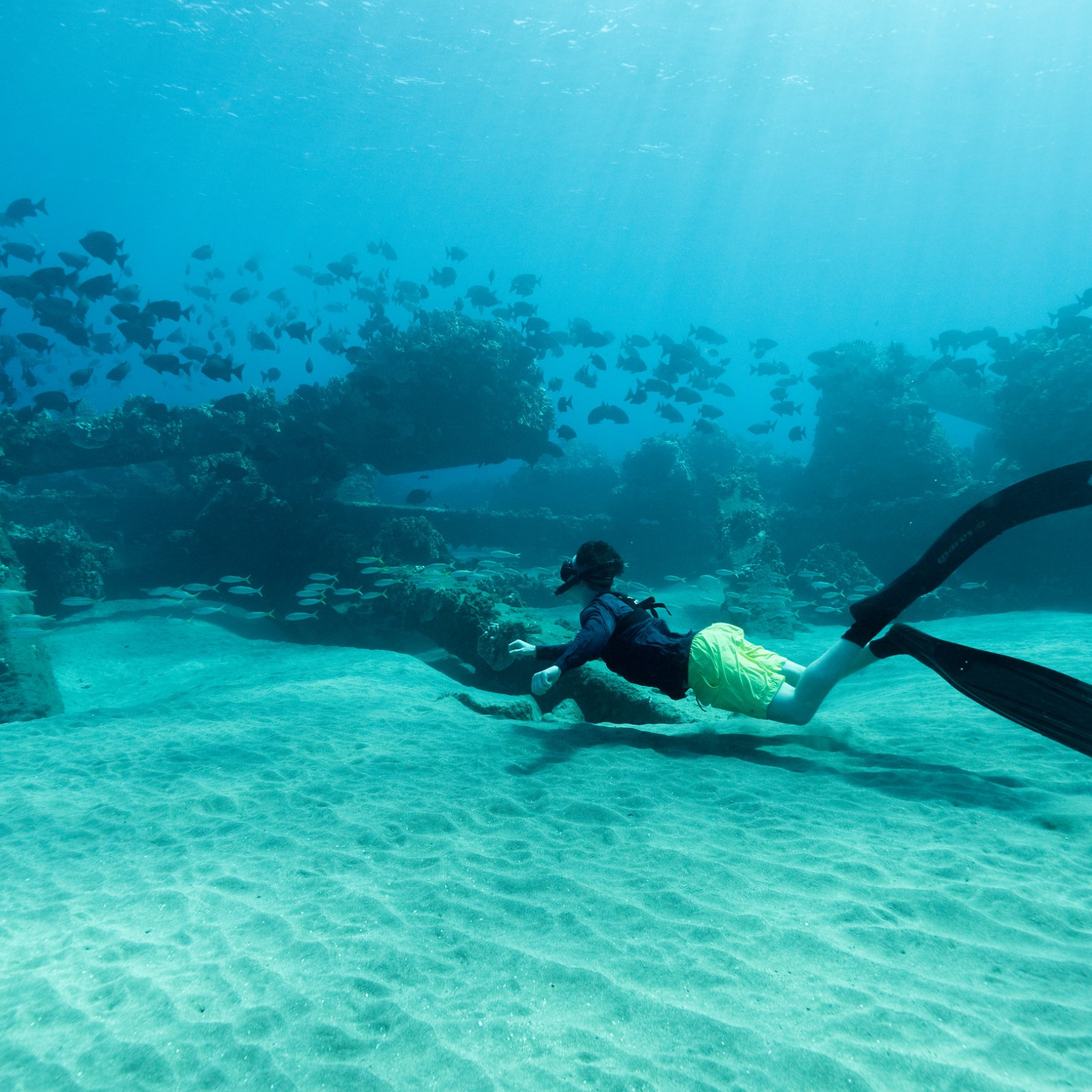 a man swimming in a body of water